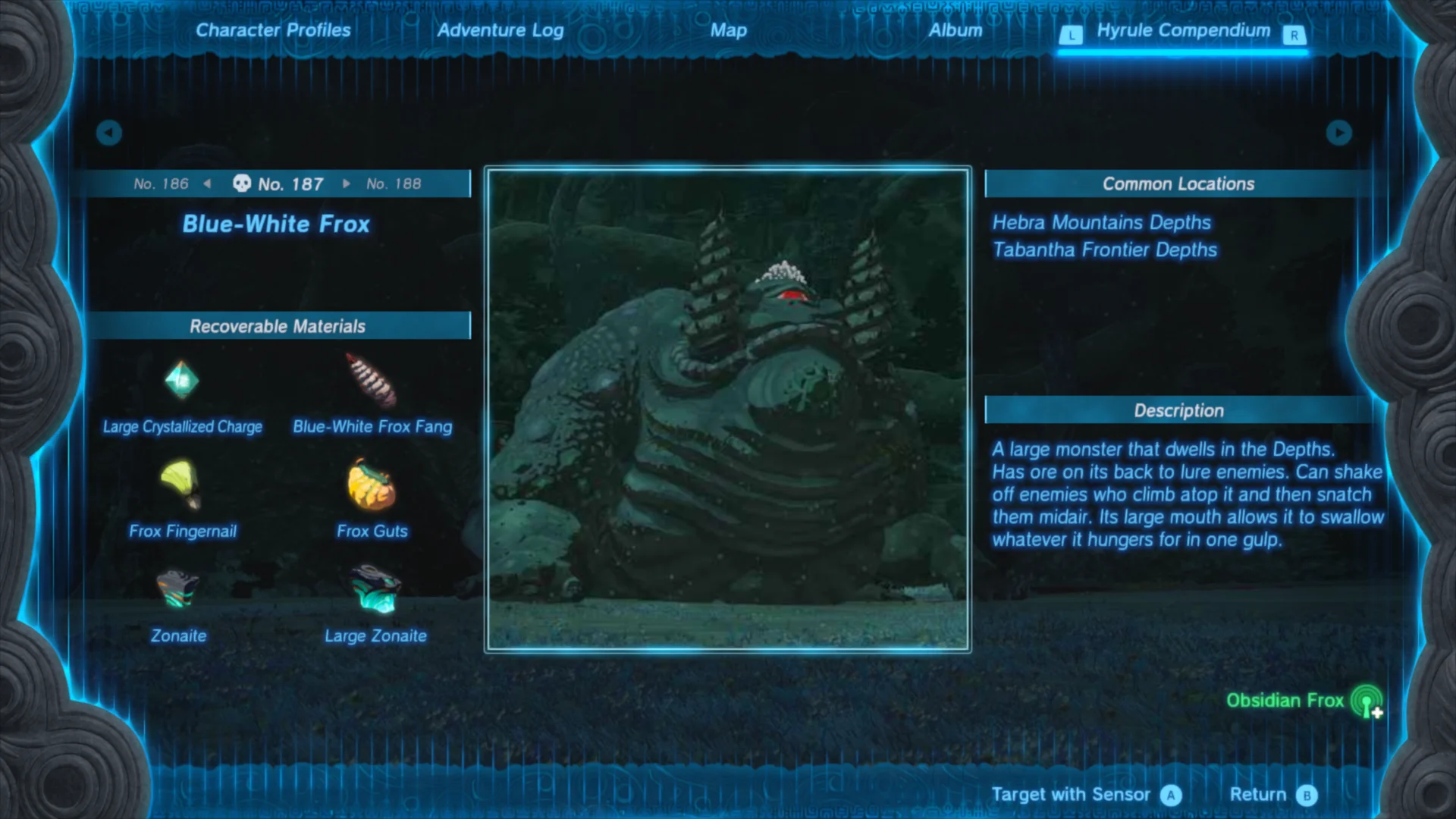 A menu displaying 'No. 187 Blue-White Frox' and featuring an image of the named monster alongside some flavor text, locations it can be found and crafting materials it drops when defeated.