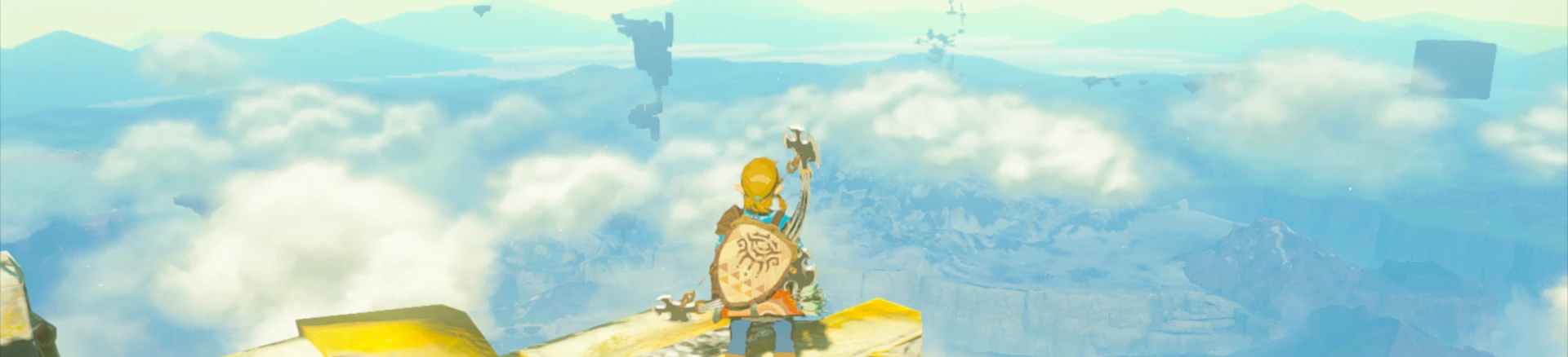 Link looking over a cloud-studded landscape in a screenshot captured in Tears of the Kingdom.